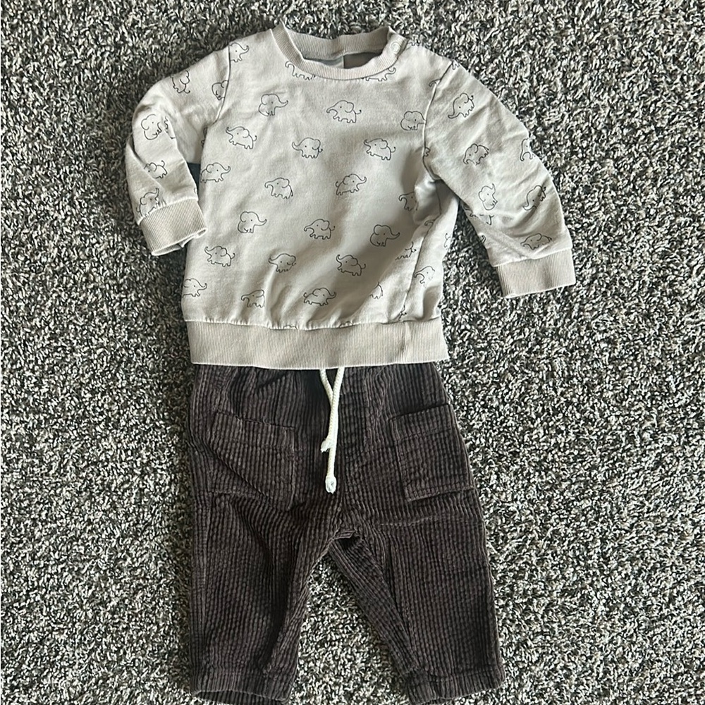 Tan elephant sweater and brown corduroy pants